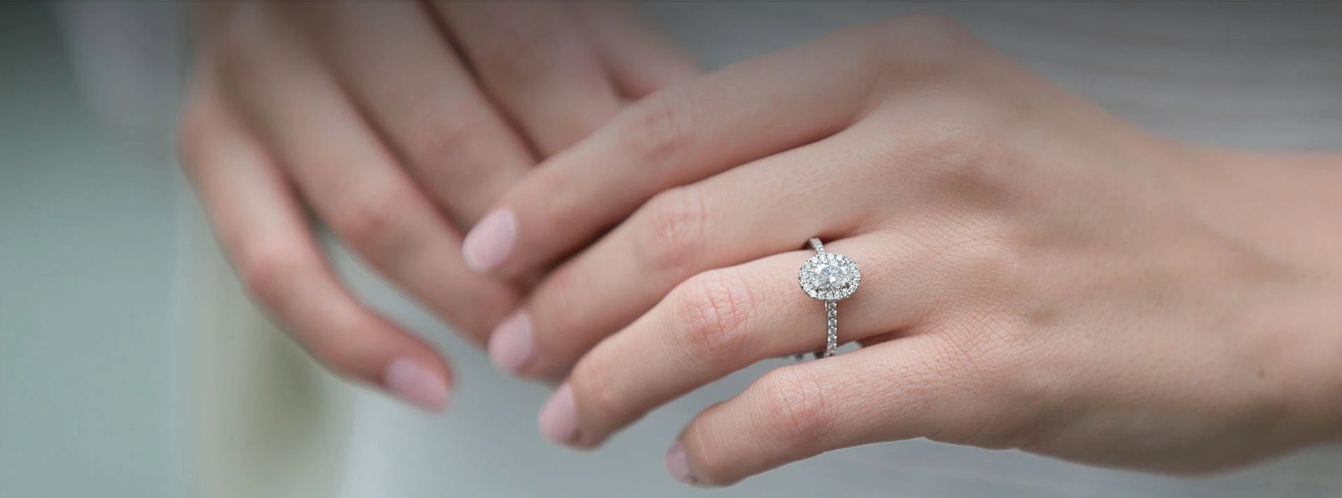 Oval cushion clearance cut engagement rings