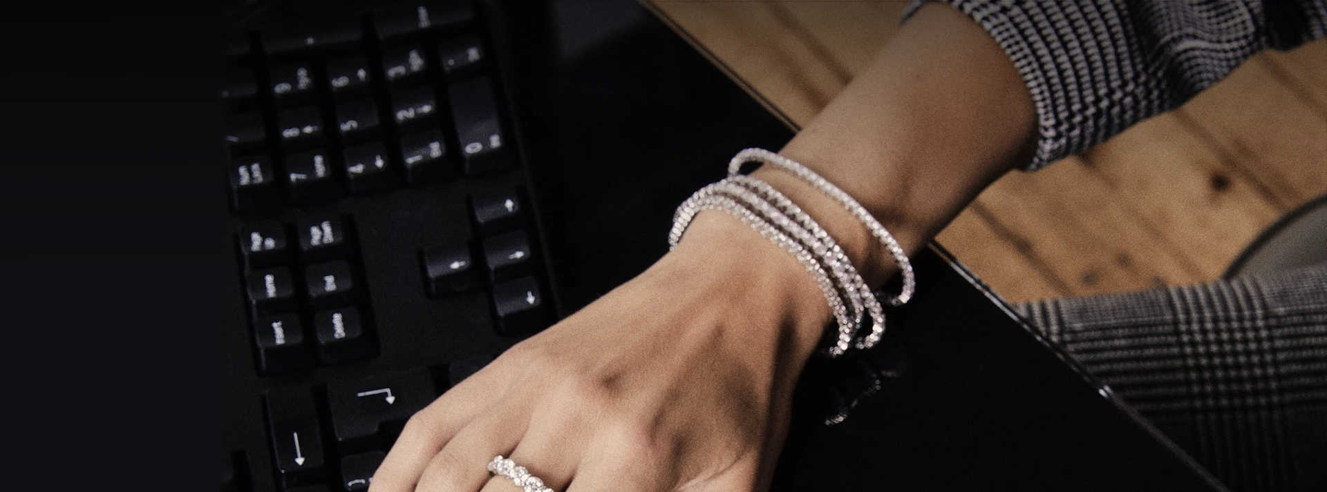 Woman at Keyboard Wearing ROX Bracelet