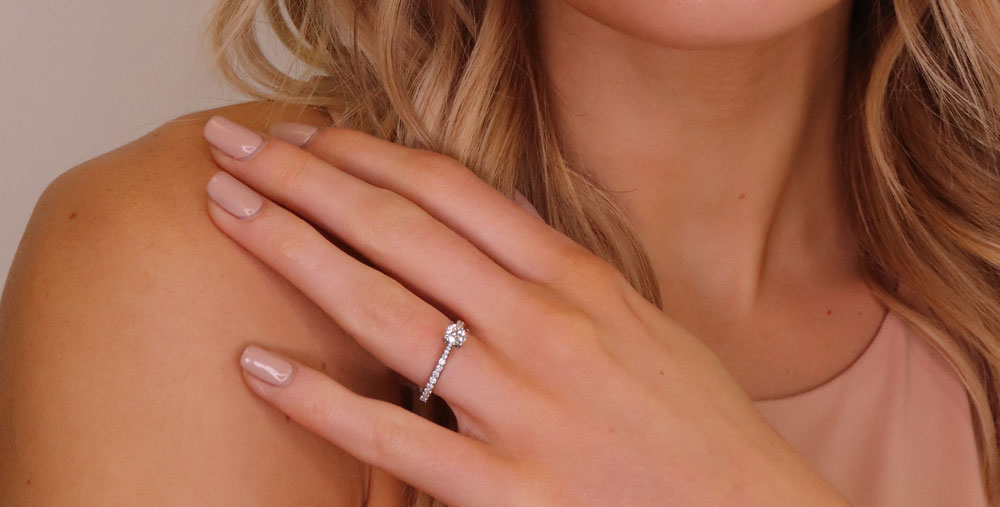 woman wearing diamond engagement ring