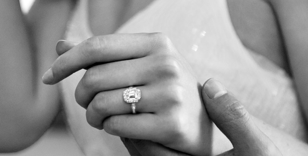 image of woman wearing a diamond engagement ring