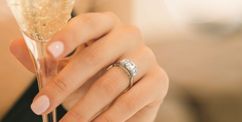 woman wearing diamond engagement ring