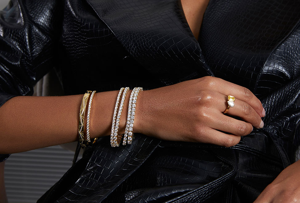 woman wearing multiple diamond bracelets