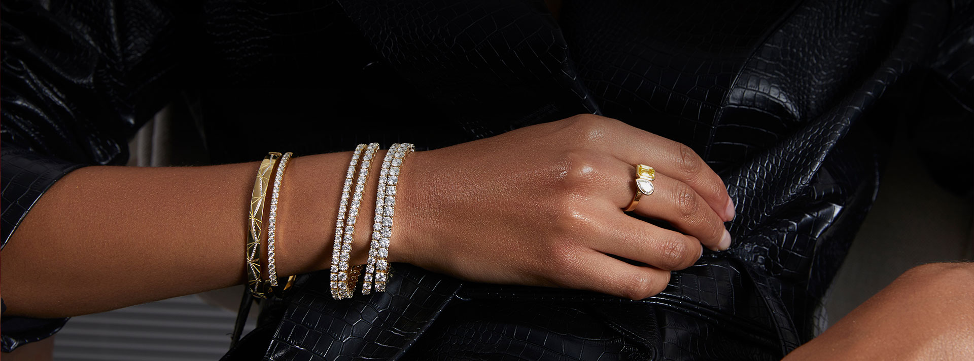 woman wearing multiple diamond bracelets