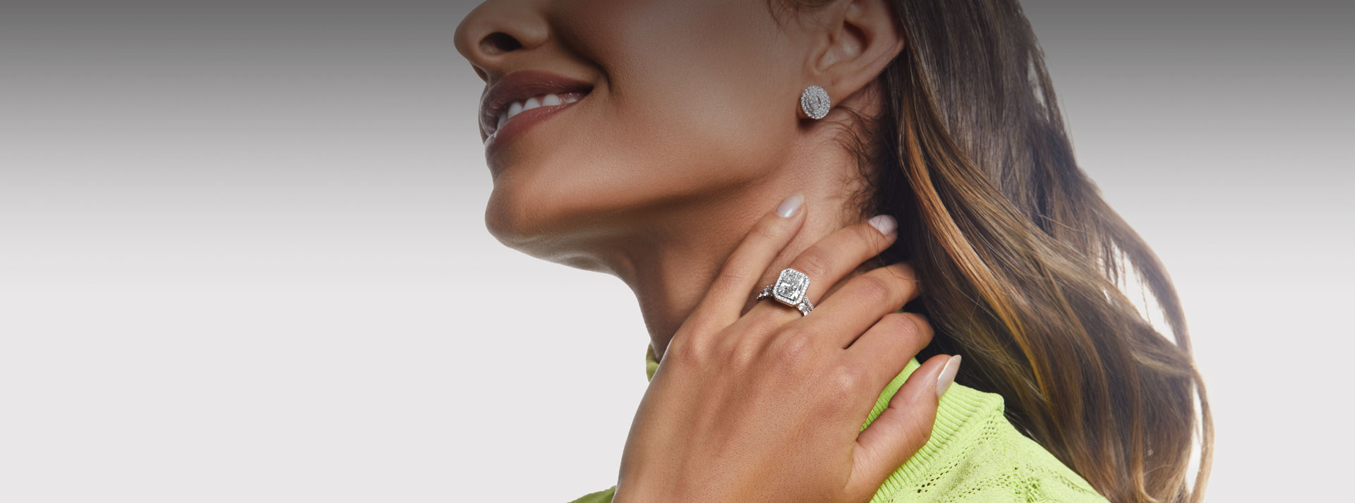 woman wearing a halo diamond ring